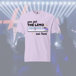 May include: A light purple t-shirt with the text "you get THE LIMO out front" in black and a graphic of a white and purple train. The shirt is short-sleeved.