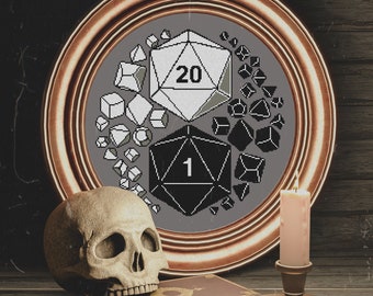 May include: A framed cross-stitch design featuring a 20-sided die and a 1-sided die, surrounded by smaller dice. The frame is a dark brown wood with a gold trim. A human skull sits on a book, and a candle sits on a candlestick.