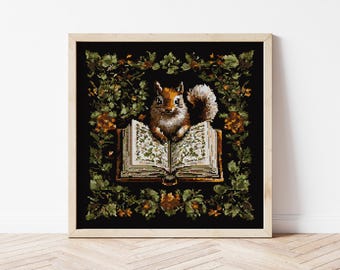 May include: A framed cross-stitch art piece featuring a squirrel sitting on an open book. The squirrel is brown and white, with a fluffy tail. The book has detailed floral illustrations. The artwork is surrounded by a green and orange floral border.