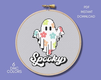 May include: Cross stitch pattern featuring a cute ghost with floral print and the word "Spooky" in a whimsical font. The pattern uses 6 DMC colors.