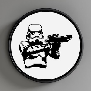 May include: Black and white pixel art illustration of a Stormtrooper from Star Wars holding a blaster rifle.