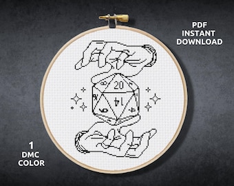May include: Black and white cross stitch pattern of two hands holding a twenty-sided die. The die is in the center of the design and has numbers 1 through 20 on its faces. The hands are stylized and have a simple design. The background is white.