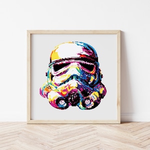 May include: A colorful pixel art illustration of a Star Wars Stormtrooper helmet. The helmet is rendered in shades of blue, green, yellow, orange, and pink.