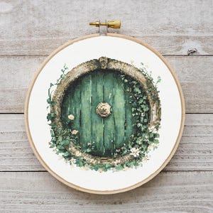 May include: A round green door with a round knob surrounded by vines and white flowers. The door is set into a round frame and is surrounded by a white background.