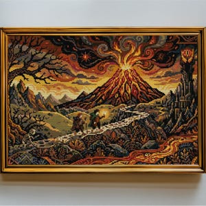 May include: A framed cross-stitch embroidery depicting a volcanic landscape with a glowing mountain, a dark tower, and two small figures walking along a path. The scene features warm orange, red, and yellow tones contrasted with dark brown and black.