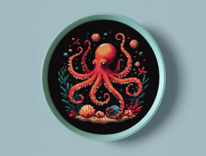 May include: A cross-stitch embroidery design featuring a red octopus with eight tentacles surrounded by coral, seashells, and bubbles on a black background.