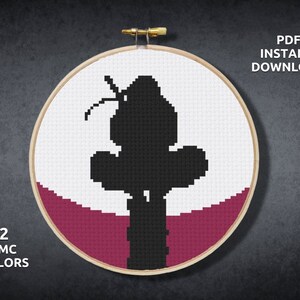 May include: A black and white cross stitch pattern of a silhouette of a cactus with a burgundy background. The pattern is in a round embroidery hoop. The text "PDF INSTANT DOWNLOAD" and "2 DMC COLORS" is also included in the image.