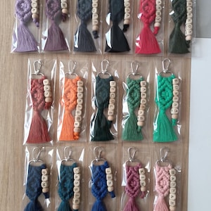 Customizable Macrame Name Keychain with a lots color options. 44 different rope colors and 10 different hook types, Perfect gift ideas for bridesmaids, friends and family. 
Macrame Name Keyring, Macrame Wedding favors, Bridesmaid Proposals, will you be my bridesmaids, maid of honor gift, matron of honor gifts, gift for friends, christmas gifts for friends and co-workers, macrame bag charm, birthday gifts ideas, mothers day gifts, womens day gifts, gift for women, gift for mom, gift for her,