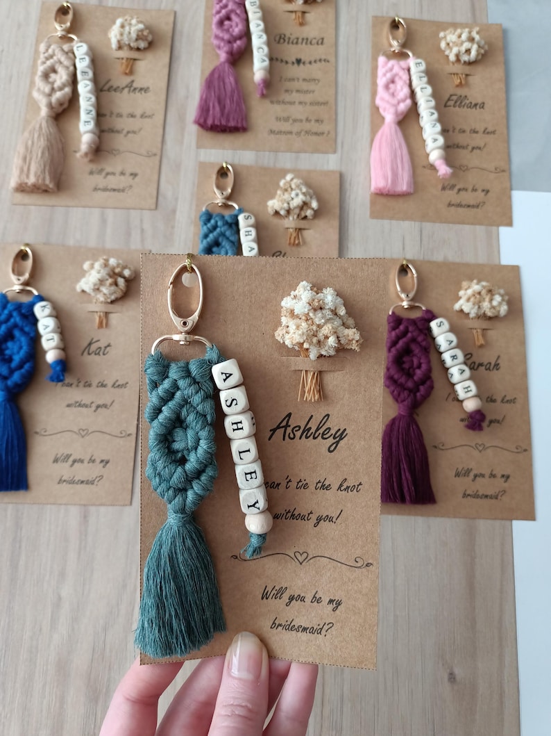 Bridesmaid Name Keychain, Macrame Name keychain gifts with 44 color options and customizable options. Wedding gifts, bridesmaid gifts, bachelorette gifts, bridal shower gifts, Bridal shower favors, matron of honor gifts, maid of honor gifts, bride favors, Tie the knot gifts, Bridesmaids gift box, Bridesmaid Proposals, Gifts for Bridesmaids, Flower Girl Gifts, Best Man Gifts, will you be my bridesmaid, bridesmaid proposal gift, wedding favors, handmade wedding gifts, name keyring, beaded keychain