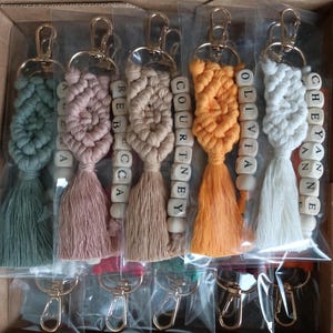 Customizable Macrame Name Keychain with a lots color options. 44different rope colors and 10 different hook types, Perfect gift ideas for friends and family. 
Macrame Name Keyring, Macrame Wedding favors, Bridesmaid Proposals, will you be my bridesmaids, maid of honor gift, matron of honor gifts
 gifts for her, gifts for friends, christmas gifts for friends and co-workers, macrame bag charm, birthday gifts ideas, Macrame name keyring, name keychain, co-worker gifts, employees gifts,