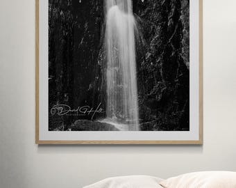 Dramatic Cliffside Waterfall Black and White Photo
