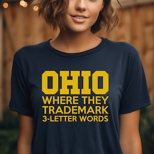OHIO where they trademark 3-letter words Michigan Go Blue Unisex Heavy Cotton Tee