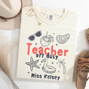 Comfort Colours Personalised Teacher Off Duty Shirt Teacher Summer Break Shirt Schools Out Summer Teacher Off Duty Beach T-Shirt with name.