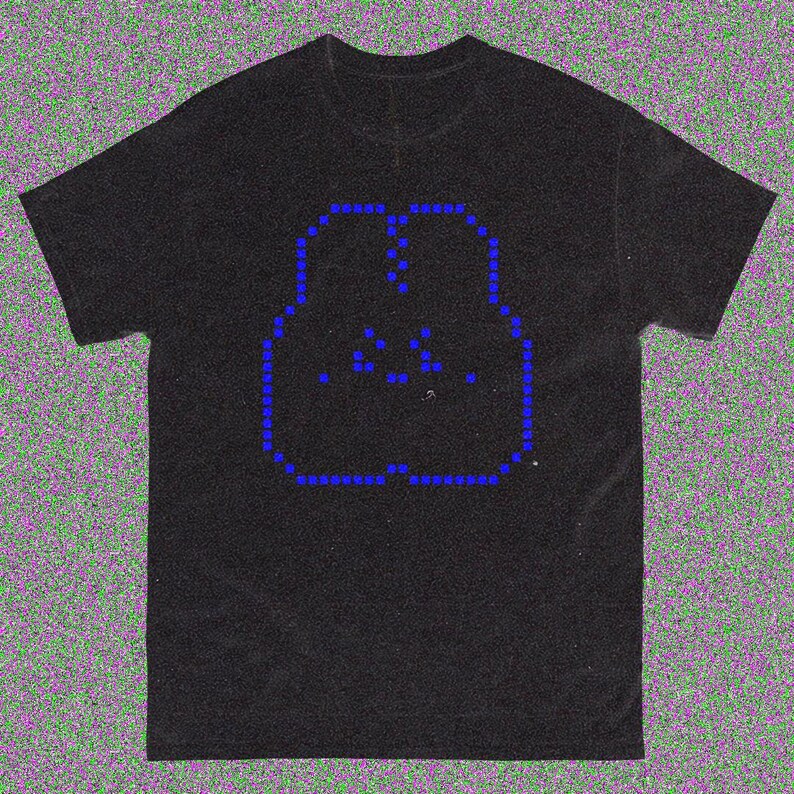May include: Black t-shirt with a blue pixelated design depicting two figures in an embrace. The design is outlined with small blue squares and has additional blue dots within the figures. The shirt has a crew neck and short sleeves.