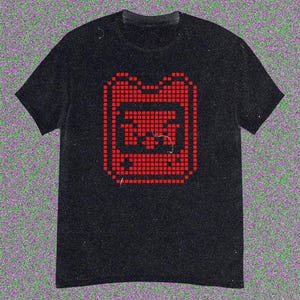 May include: Black t-shirt with a red pixelated graphic of a retro handheld gaming device. The design is centrally placed on the front. The t-shirt has short sleeves and a crew neck.