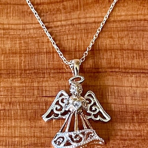 Sterling Silver with gold plating two tone angel pendant with 18” chain.