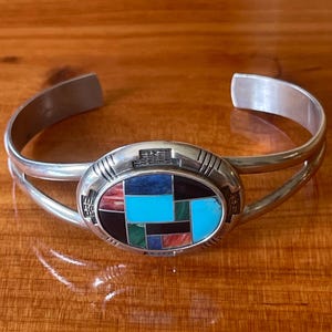 Sterling  Sulver with inlay stones  cuff bracelet…Beautiful Zuni signed bracelet.