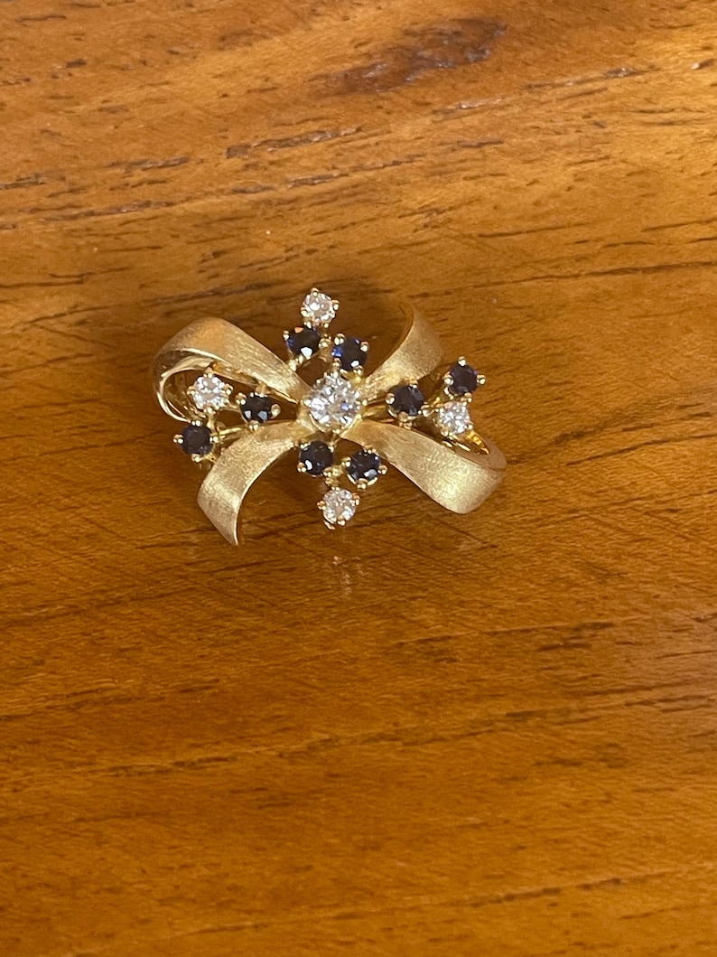 18Kt diamonds and sapphires bow pin includes GAL Appraisal image 1