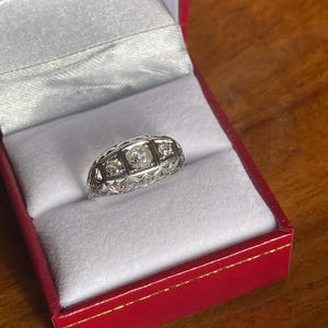18kt and approximately .35 carats of diamonds antique ring.