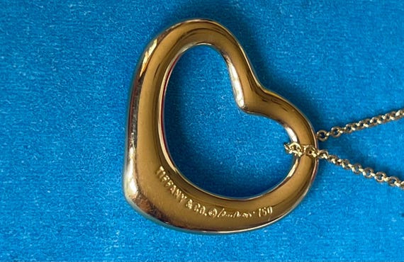 Tiffany 18kt gold floating heart and 18” Tiffany Chain!