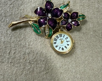 flower brooch with watch