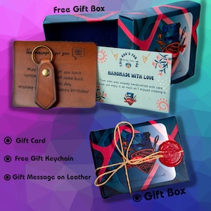 May include: A gift set featuring a brown leather keychain and a gift card with a message. The set includes a gift box wrapped in blue and red patterned paper, tied with twine and sealed with red wax. The gift box is labeled "Free Gift Box".