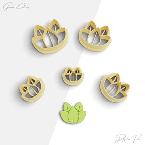 May include: Set of six cookie cutters in the shape of a lotus flower. The cutters are made of yellow plastic and come in different sizes. The smallest cutter is green.