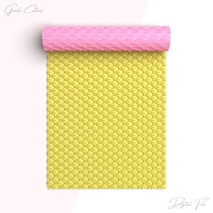 May include: A rolled-up pink mat with a yellow, scale-like pattern. The mat is unrolled to reveal the same pattern. The text "Graeda Cutters" and "Digital File" are in the image.
