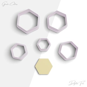 May include: Set of six hexagon-shaped cookie cutters, five are white and one is yellow. The cutters are arranged on a white and gray background.  The text "Digital File" is at the bottom of the image.