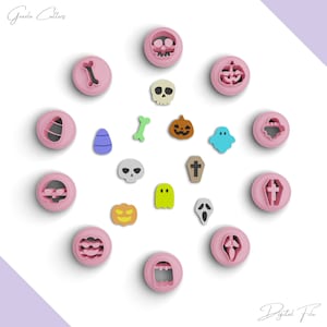 May include: A set of 17 pink plastic Halloween cookie cutters featuring various spooky designs, including ghosts, skulls, pumpkins, bones, and a coffin. The cutters are arranged on a white background.