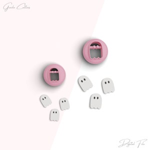 May include: Two pink ghost-shaped cookie cutters and five white ghost-shaped cookie cutters.  The cookie cutters are on a white and pink background.  The text "Digital File" is at the bottom of the image.