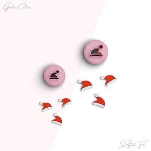 May include: A collection of Christmas-themed cookie cutters. The image features several red and white Santa hats and pink circular cutters with a Santa hat design. The words "Gezila Cutters" and "Digital File" are in the image.