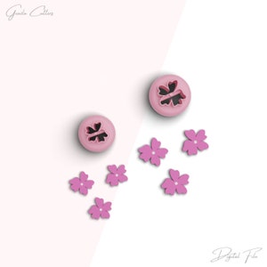 May include: Two pink flower-shaped cookie cutters and six pink flower-shaped cookie cutouts on a white and pink background.  The text "Digital File" is at the bottom of the image.