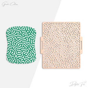 May include: Two die-cut shapes. One is a green and white pattern, the other is a beige square with a similar pattern. The words "Graeda Cutters" and "Digital File" are written in cursive.