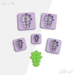 May include: Five purple plastic cookie cutters shaped like oak leaves, and one green oak leaf cookie cutter.  The text "Digital File" is at the bottom of the image.