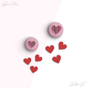 May include: Two pink heart-shaped cookie cutters with a striped design inside. Five red heart-shaped cookie cutters with a striped design are scattered around the pink cutters. The text "Digital File" is in the bottom right corner of the image.