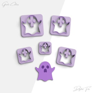 May include: A set of five purple plastic ghost cookie cutters. The cutters are in different sizes and feature a simple ghost design with two eyes and a mouth.