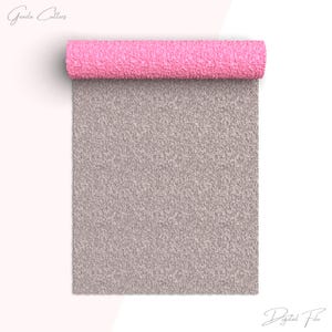 May include: A rolled-up pink textured material sits atop a larger, unfolded gray textured material. The image has the text "Greeda Cutters" and "Digital File" in the corners.