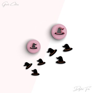May include: A set of seven witch hat cookie cutters. Two of the cutters are pink and the other five are black with orange accents. The cutters are arranged on a white surface.