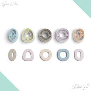 May include: Set of ten cookie cutters in various shapes and colors, including circles, ovals, and a triangle. The cutters are made of plastic and are designed for use with fondant, cookie dough, or other edible materials.