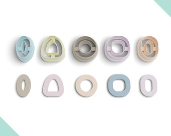 May include: Set of ten cookie cutters in various shapes and colors, including circles, ovals, and a triangle. The cutters are made of plastic and are designed for use with fondant, cookie dough, or other edible materials.
