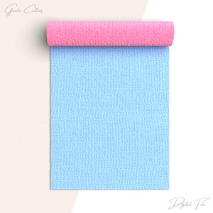 May include: A roll of light blue textured fabric with a pink fabric backing. The fabric is rolled up and the pink backing is visible.
