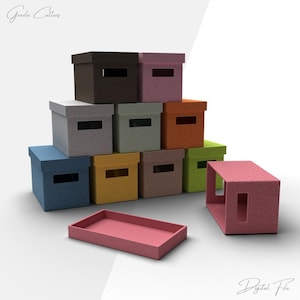 May include: A collection of colorful storage boxes in various shades, including blue, brown, and pink. Each box has a rectangular opening and a matching lid. A pink tray sits in front of the boxes. The words "Gooda Cutters" and "Digital File" are in the image.