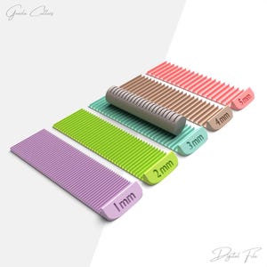 May include: A collection of colorful, ribbed cutters in various sizes, ranging from 1mm to 5mm. The cutters are in shades of purple, green, teal, brown, and pink. The image includes the text "Goode Cutters" and "Digital File".