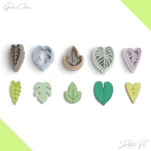 Puede incluir: Conjunto de 10 cortadores de galletas con forma de hoja en varios colores y diseños. Los cortadores están hechos de plástico y son perfectos para hacer galletas, fondant u otras decoraciones comestibles.