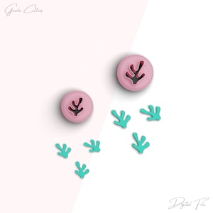 May include: Two pink cookie cutters shaped like coral, and five teal coral cookie cutters. The cookie cutters are on a white and pink background. The text "Digital File" is at the bottom of the image.
