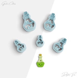 May include: A collection of light blue potion bottle-shaped cookie cutters and a green and yellow potion bottle. The cutters are arranged on a white surface. The image is a digital file.