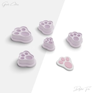 May include: Set of six paw print cookie cutters, including a small paw print, in a light purple color. The cutters are arranged on a white background. Digital File.
