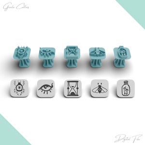 May include: Five light blue plastic cookie cutters with matching square stamps featuring designs of a beetle with an eye, an eye, an hourglass, a moth with an eye, and mushrooms in a jar. The text Geazla Cutters and Digital File is visible.