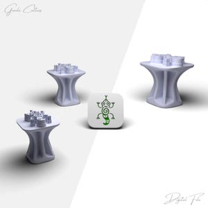 May include: Four light purple 3D-printed objects. Three are pedestal-shaped with a platform top. The fourth is a white square with a green lizard graphic. The text "Graeda Cutters" and "Digital File" are in the image.